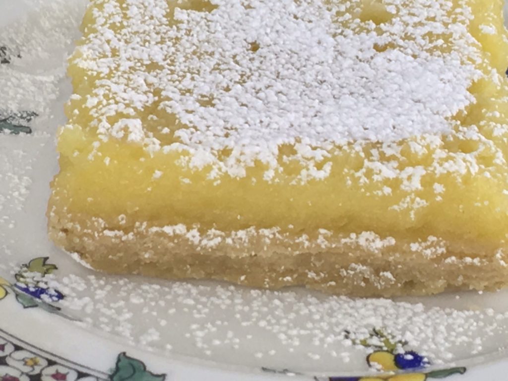 Extra tart Lemon square close up. 